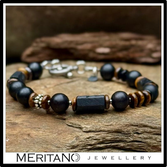 Bransoletka męska turmalin i tygrysie oko, leżąca na kamieniu Bransoletka męska turmalin i tygrysie oko, leżąca na kamieniu