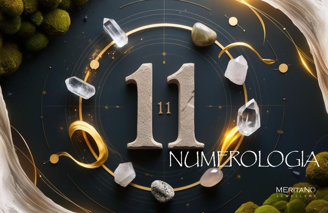 Numerologia 11 – liczba mistrzowska, złota symbolika na ciemnym tle, kryształ górski i kamienie naturalne wokół liczby 11, grafika Meritano Jewellery