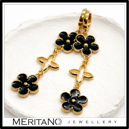 długie kolczyki wiszące czarno złote kwiaty - widok na białej tacy